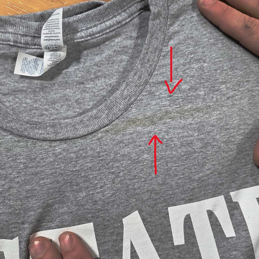 Brown discolored scorch mark on garment from excess heat